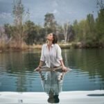 "Person practicing mindfulness meditation to manage chronic illness and improve well-being."